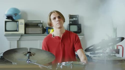 Man Playing Drums in Studio