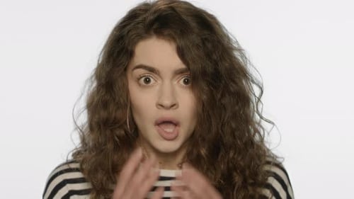 Shocked Woman Reacting in Fear and Surprise