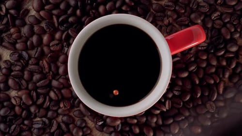 Coffee Cup with Beans Close Up Shot