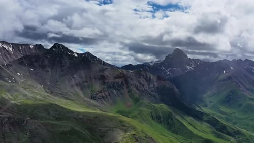 Scenic Mountain Range Aerial View with Cloudy Sky