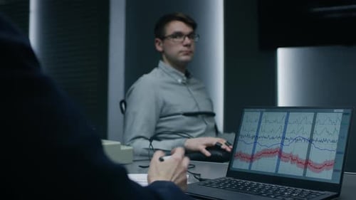 Young Handsome Suspect During Interrogation Undergoes Lie Detector / Polygraph Test, Connected to t