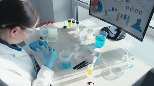 Scientist Prepares Experiment in Bright Modern Laboratory