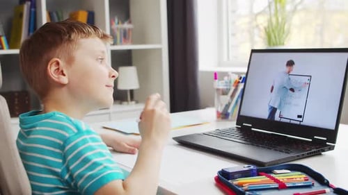 Boy Studying Math Online at Home with Laptop