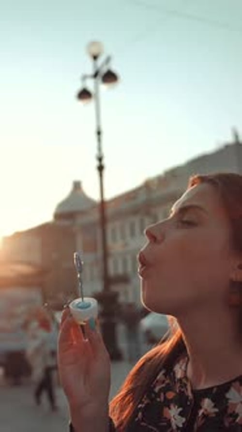 Vertical of Love and Soap Bubbles Blow By Married Couple