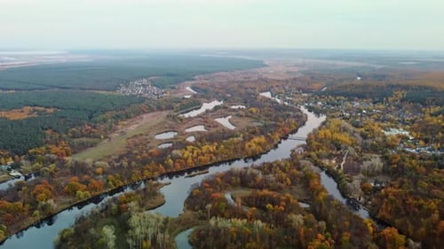 Autumn aerial above river with colorful riverbanks