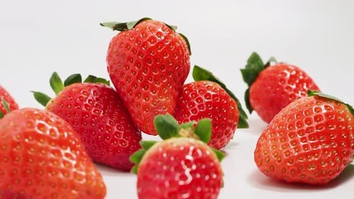 Ripe strawberries on a white background. Strawberries close up.