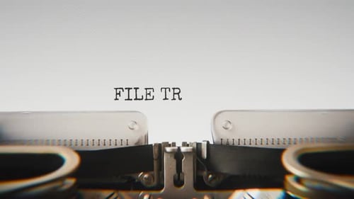 Old mechanical typewriter typing File Transfer Complete in a close-up view.