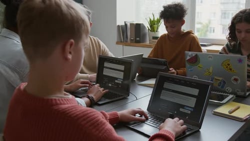 Multiethnic Schoolchildren Practicing in Writing AI Prompts at Lesson