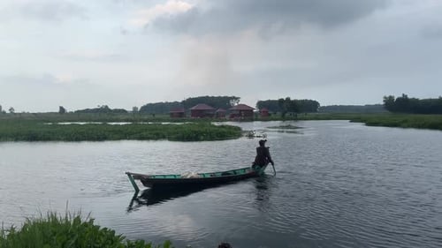 a fisherman in a lake who is going to catch fish.