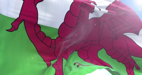 Waving Flag of Wales against a Bright Blue Sky