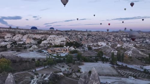 Balloons Over Cappadocia's Magical Landscape at Sunrise