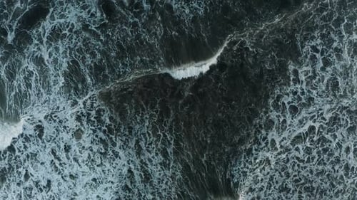 Waves and Foam in the Ocean View From Above Dark Water