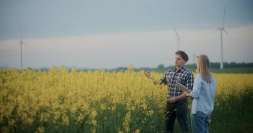 Agronomist And Farmer Discussing In Farm