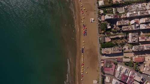 Aerial view of beach with umbrellas along Mediterranean, Turkey.