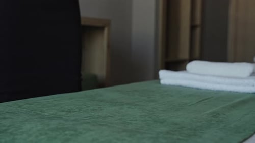 Female Hands in a Hotel Room Lay Out Fresh and Clean Towels for Guests Hotel Service Maid Prepares
