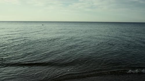 Tranquil Sunset Ocean Waves Background
