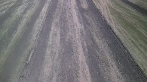 Tractor working on the field doing tillage with cultivator