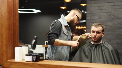 Barber Trimming Hair in Modern Barbershop