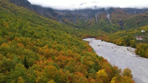 Autumn colors on Alpine village of Northern Albania, golden trees in beautiful Valbona valley