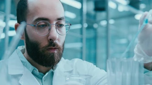 Scientist Concentrating on Experiment in Lab