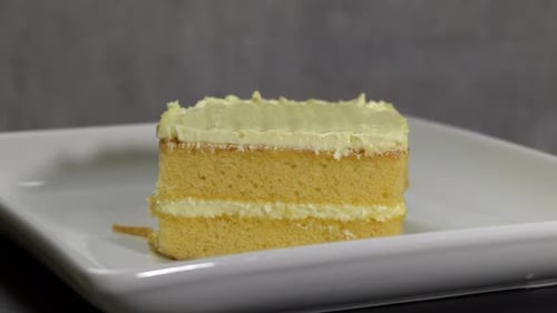 Yellow Cake with White Icing on Plate