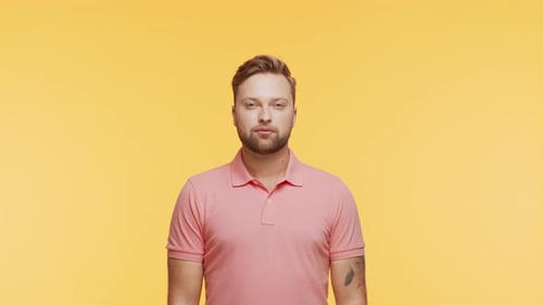 Expressive Young Man Over Vibrant Background Studio Portrait of Handsome Person