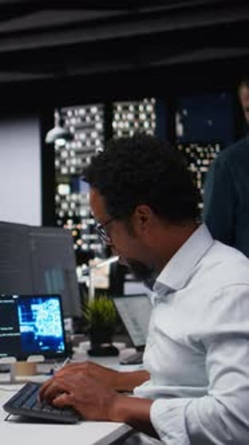 Vertical Video Tech Startup IT Professional Developing AI Algorithms in High Rise Office