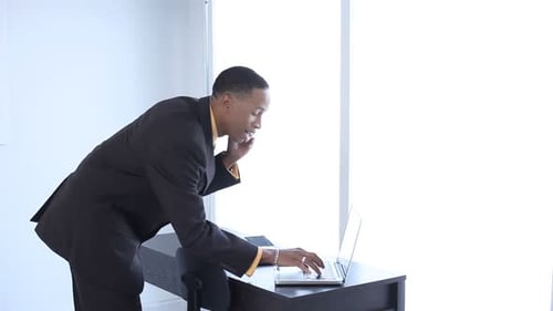 Businessman in Office Talking on Cell Phone 30-35