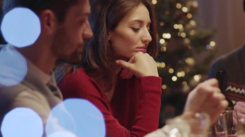 Friends Conversing at Christmas Celebration Indoors