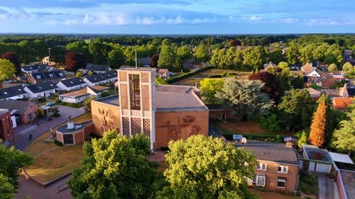Unusual building of a church with bells tower over the entrance.