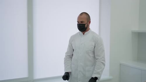 Male Doctor Turns on Virtual Screen