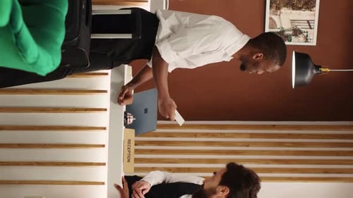 Vertical Video Newlywed Couple Checking in Posh Hotel