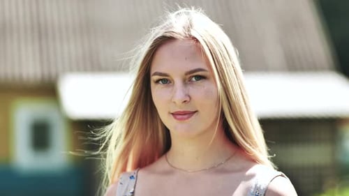 Woman Smiling Gently into Camera Close Up