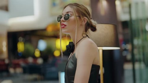 Stylish Woman with Sunglasses in Urban Setting