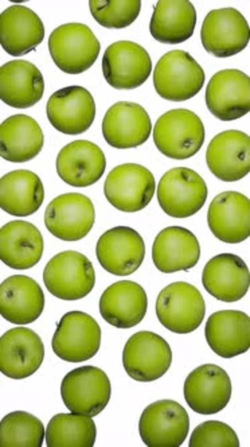 Vertical Falling Green Apples on White
