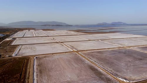 View of a Salt Flat Factory Besides the Sea Drone Shot of Salt Extraction