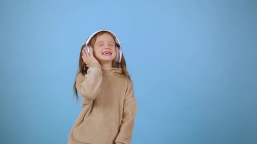 Joyful Girl Dancing, Listening Music with Headphones