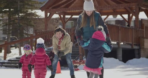 Family Playing Ice Skating