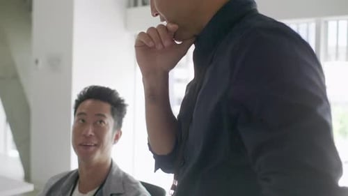 Two Men Collaborating in a Modern Office Setting