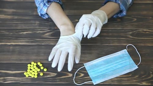 Wears Medical Gloves