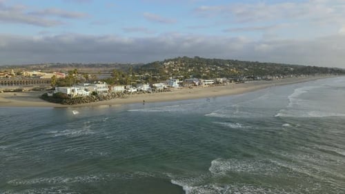 Aerial View of Beachfront Property on Sunny Coastline