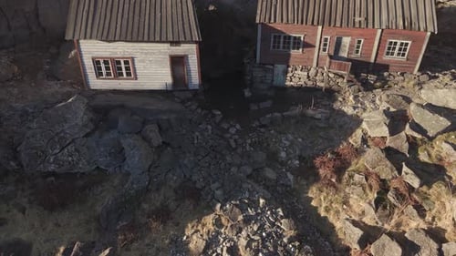 Historical site called Helleren in Norway. Teo old houses under cliff