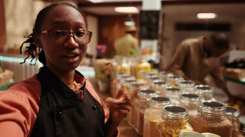 Enthusiastic Woman Showing Food at Marketplace