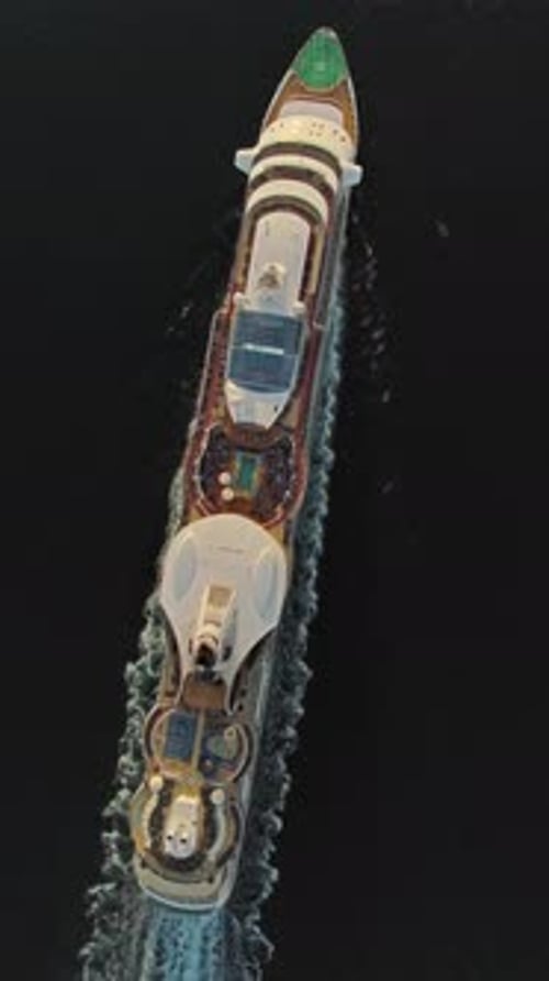 Sailing cruise ship aerial top view