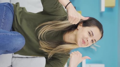 Vertical Video of Happy teenage girl saying super good idea to camera.