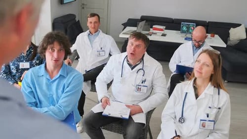 Medical Team Sitting at Hospital Seminar Presentation