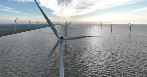 Wind turbine at open water, off shore wind mill park. Energy and sustainability system. Green power.