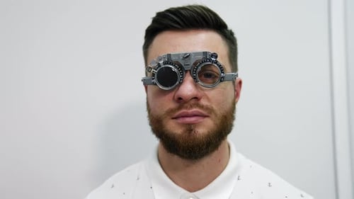 Man Having Eyesight Exam, Glasses with Lenses