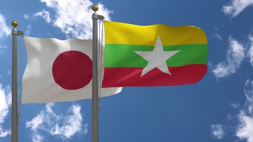 Japan Flag Vs Myanmar Flag On Flagpole