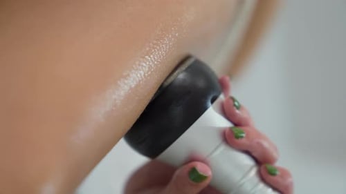 Close Up on Woman's Arm With Device